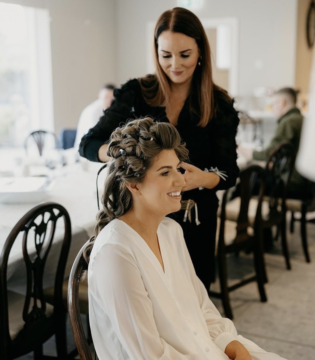 Laura styling a bride's braided updo
